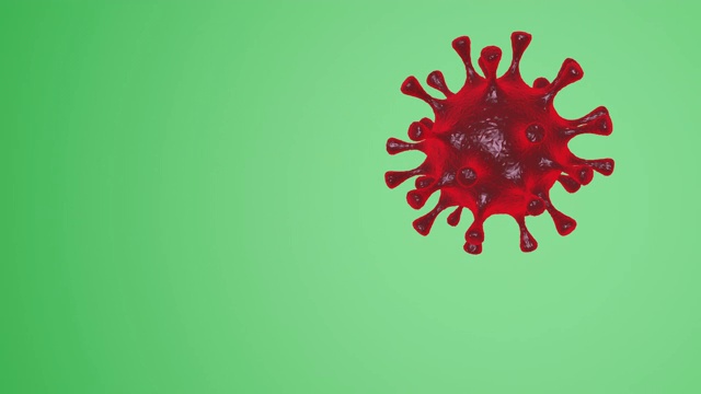 红色病毒在绿色背景下移动的动画视频- Covid-19冠状病毒概念- 3D渲染