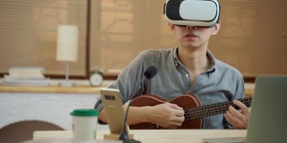 亚洲人使用VR耳机在家里在线教吉他