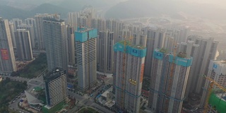 傍晚雾霾长沙城市公寓住宅综合体超大型建设航拍全景4k中国