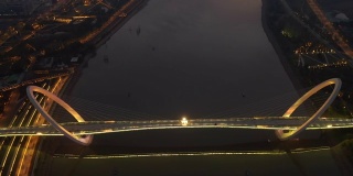 sunset night illumination nanjing city youth cultural center famous pedestrian riverside eye bridge aerial panorama 4k china