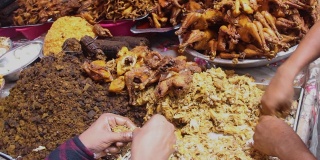 厨师的手正在准备古老的达卡传统食物在街头食品市场，节日，活动。街头食品的概念。