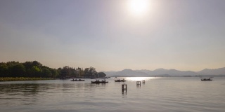 日落时间杭州市著名的湖泊观光船交通湾全景时间间隔4k中国