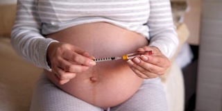 孕妇在腹部注射胰岛素。糖尿病和妊娠。