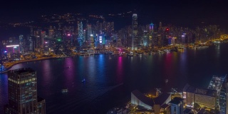 飞行在香港城市维多利亚港市中心夜光航拍全景，4k时间间隔