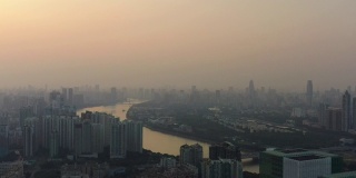 日落雾霾广州城市景观河滨航拍全景4k中国