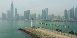 白天青岛城湾建设著名灯塔码头航拍全景4k中国