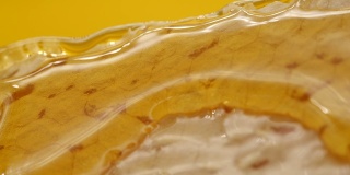 Close-up of honey falling