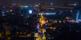 中国夜景时间照亮武汉城市景观交通街道沿江航拍全景，4k时间流逝