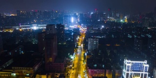 china night time illuminated wuhan cityscape traffic street aerial panorama 4k time lapse