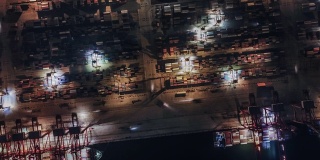 T/L Drone View of Busy Industrial Port with Containers Ship at Night