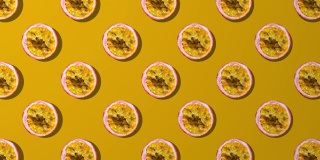 橘色背景上的百香果切片纺纱图案