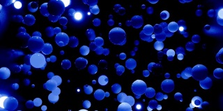 摘要4k背景的球在阴影的蓝色。像发光二极管这样的球悬挂在空中，发光，然后熄灭。明亮的背景