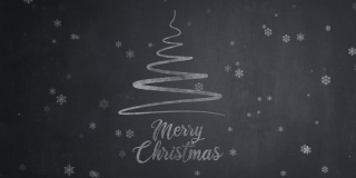 手绘圣诞快乐的文字与圣诞树在黑板上