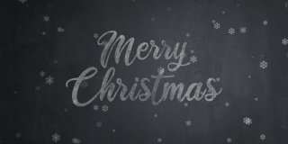 在黑板上手绘圣诞快乐的文字