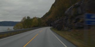 行驶在挪威峡湾的POV汽车:进入隧道