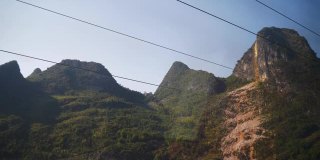 阳光明媚的一天火车公路旅行到广州通过著名的山脉pov全景4k中国