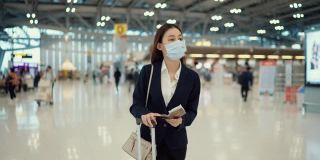 年轻的企业家在机场时戴上防护口罩