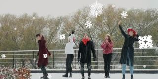 朋友们正在捕捉动画雪花。结合视频。冬天的乐趣。在城市里闲逛。从装饰雪花飘落。圣诞节和新年假期的传统概念