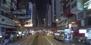 有轨电车在夜间通过香港市中心的时间推移图