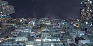 时间流逝的香港城市人口密集的住房公寓晚上。镜头指向天空。