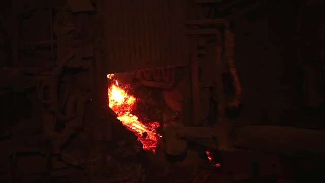 Melting of metal in a steel plant. Factory for the manufacture of metal pipes