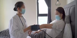 亚洲女医生用医疗设备测量脉搏