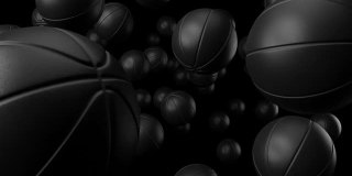 许多黑色的篮球在黑色的背景。