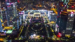中国夜景时间照亮深圳著名展览中心航拍全景，4k时间间隔视频素材模板下载
