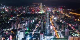 中国夜景照亮了著名的深圳市区，4k时间的航拍全景