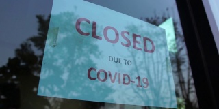 由于新型冠状病毒感染症(Covid-19病毒)，企业纷纷倒闭，商店被打上了关闭商店的标签
