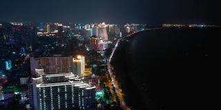 夜间照明海南岛三亚湾酒店航拍全景4k中国