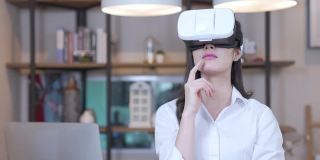 亚洲女性在虚拟现实头盔(VR Gear)思考商业想法的慢动作
