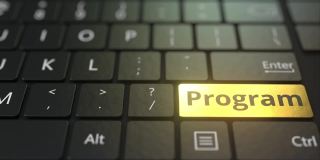 黑色的电脑键盘和金色的程序键