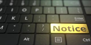 黑色的电脑键盘和金色的通知键