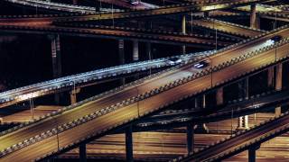 复杂的立交桥和繁忙的交通在夜间鸟瞰图视频素材模板下载