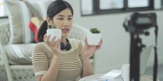 亚洲女性视频博主在网上直播如何种植盆栽植物
