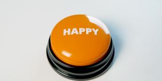 年轻女子按着橙色光滑的快乐按钮。按压它可以改善心情。祝好运，求财运。