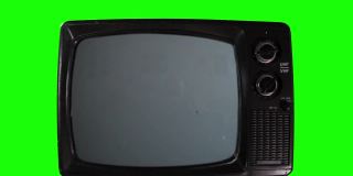 复古电视在绿色背景上打开蓝屏。特写镜头。