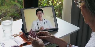 亚洲资深妇女与医生远程保健