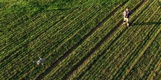 AERIAL SUPER SLO MO农民使用无人机监视农田