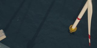 无缝循环的动画一排海上风力涡轮机在海上