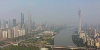 阳光明媚的傍晚广州市区交通大桥著名铁塔河边航拍全景4k中国