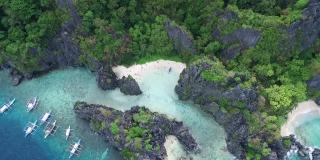 隐藏海滩在巴拉望，观光地点。在菲律宾的埃尔尼多。幽静的地方，有高耸的岩层，丰富的珊瑚和一个宁静的沙滩