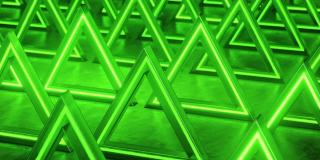 绿色三角形抽象背景。霓虹灯的背景。三角棱镜模式。抽象的科幻几何背景。未来的概念。闪烁。无缝循环，3d动画在4K