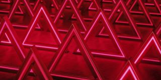 红色三角形抽象背景。霓虹灯的背景。三角棱镜模式。抽象的科幻几何背景。未来的概念。闪烁。无缝循环，3d动画在4K