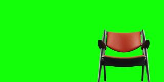 4k现代扶手椅橙色皮革和黑色木材。现代家具。旋转。循环。副本的空间。色度键为绿色背景。