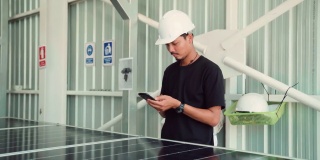 亚洲人在太阳能公司使用手机