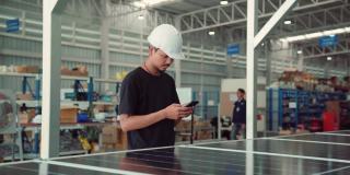 亚洲人在太阳能公司使用手机