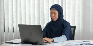 阿拉伯商业女性由于在办公室的辛苦工作而感到压力和疲惫