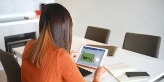 4K亚洲女性在家里用数字平板电脑和朋友视频通话